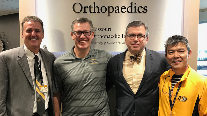From left, James Cook, PhD, DVM; Aaron Stoker, PhD; Keith Kenter, MD; and Kei Kuroki, PhD, DVM, recently gathered at the Thompson Laboratory for Regenerative Orthopaedics. Kenter received his doctorate from the University of Missouri and helped Cook start the Comparative Orthopaedic Lab at MU almost 20 years ago.