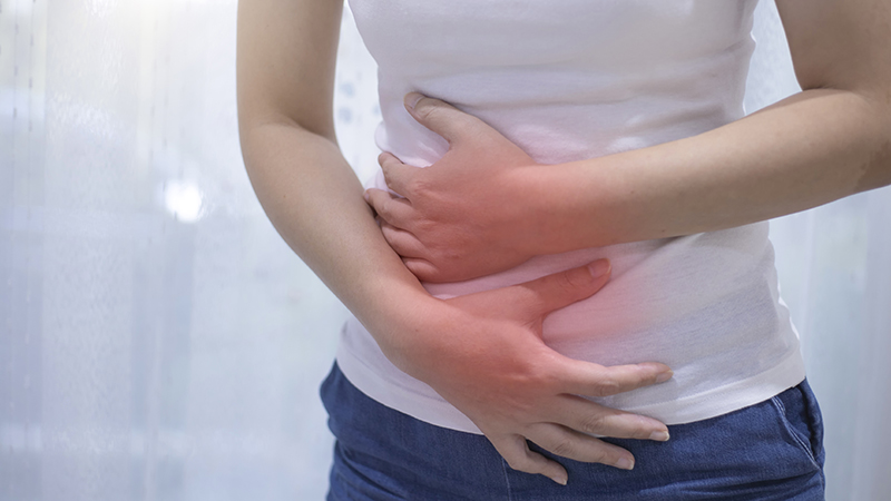 woman holding abdomen