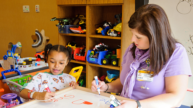 Therapist with child patient