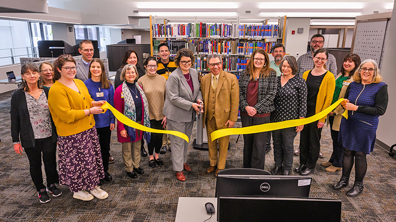 A reopening ceremony ribbon cutting