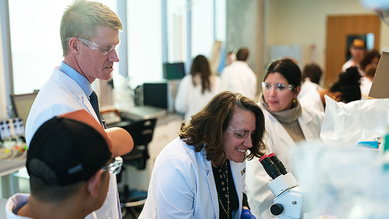 NextGen Precision Health doctors in a lab