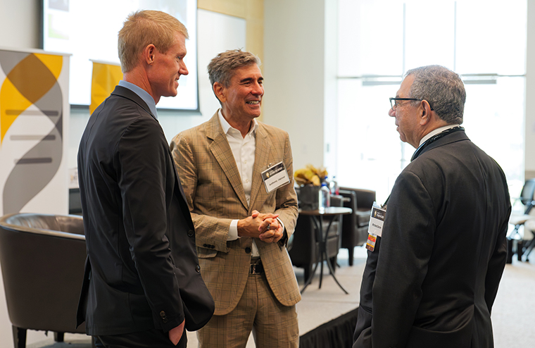 In this photo, I am seen chatting with Dr. W. David Arnold, Executive Director of the NextGen Precision Health Initiative and Dr. Anthony Japour, Chief Executive Officer and President of iTolerance, a company pioneering regenerative medicine without immunosuppression.