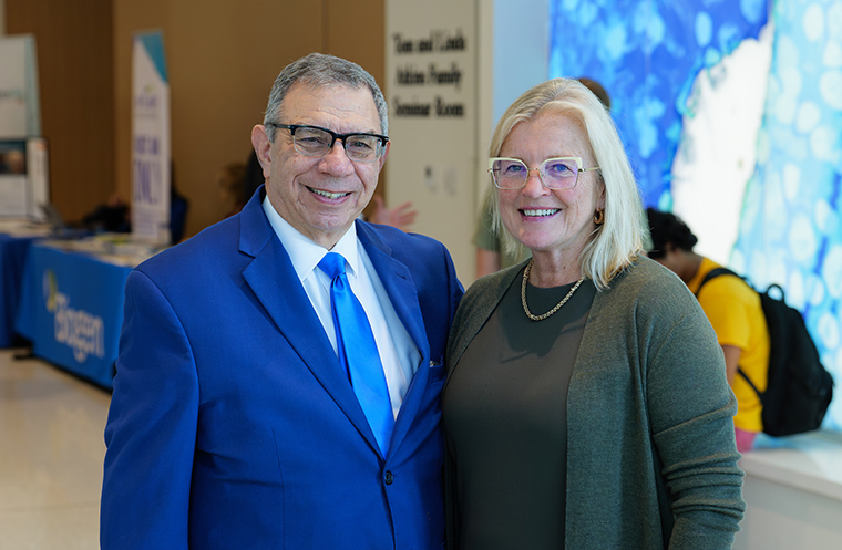 Caption: In this photo, I am seen with Angela Genge. She is an international leader in clinical trial design and development for rare neurological conditions, like ALS and other motor neuron diseases.