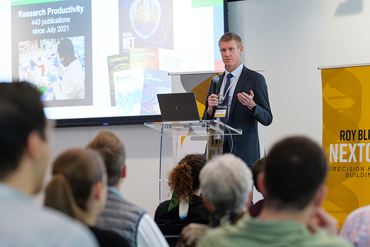 Executive Director of the NextGen Precision Health Initiative Dr. Dave Arnold speaks to participants at the NextGen Motor Neuron Symposium on Oct. 11, 2024.