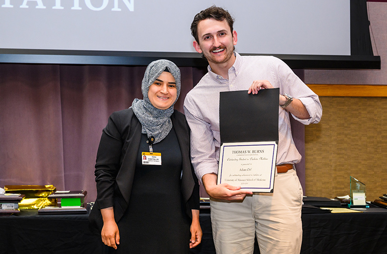  Esra Demirtas, MD, assistant professor of Medicine, presents Adam Orf with the Thomas W. Burns Diabetes Award for Outstanding Performance in Diabetes Rotation.