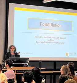 Dr. Bettina Mittendorfer, senior associate dean for research, shares insights with the gathered students and faculty.