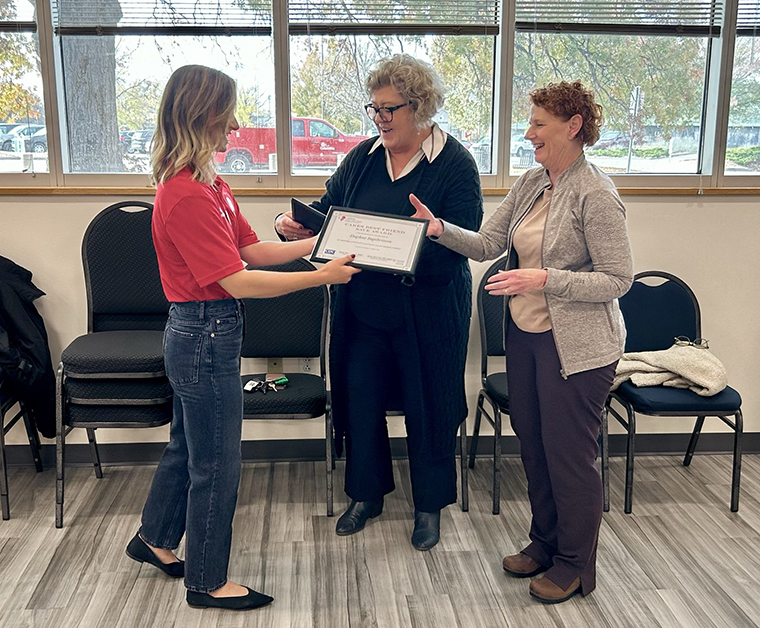 Missouri C.A.R.E.S. Coordinator Kayla Riel (left) presents the Best Friend Save Award to sudden cardiac arrest survivor Donna Pond (center) and rescuer Daphne Ingebritson (right).