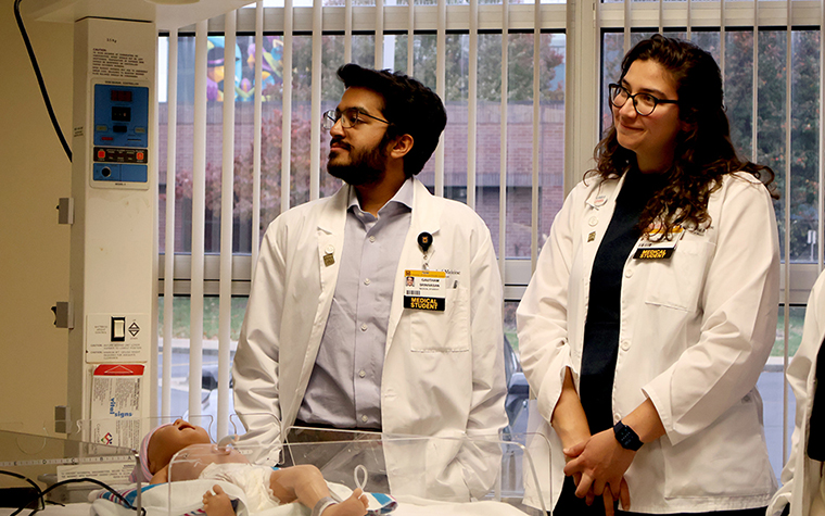 Gaby Malave and Gautham Srinivasan, both first-year students at the MU School of Medicine, listen to Beth Plaster on how simulations function. She runs the simulation center on the Springfield Clinical Campus.
