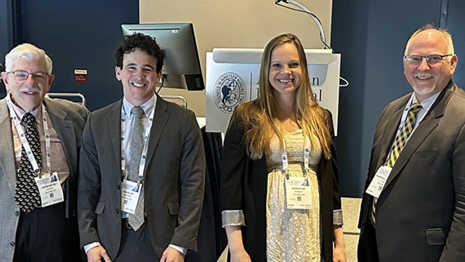 AUA 2023: chief resident Geoff Rosen and senior resident Kimmie Kocour with Drs. Wakefield and Weinstein  