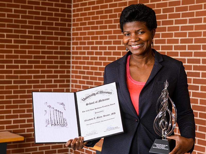 Elizabeth Malm-Buatsi, MD with her 2020 Education Day Awards for the University of Missouri School of Medicine.