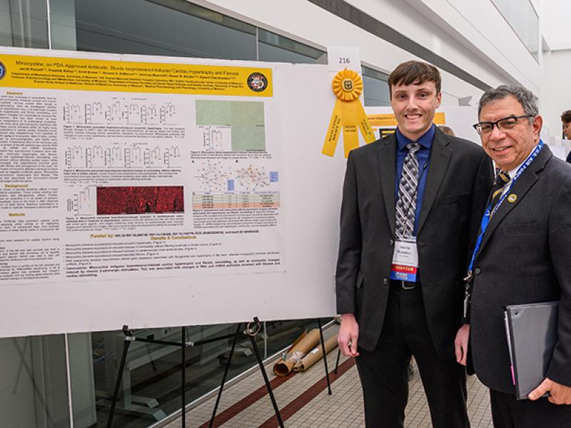 Richard J. Barohn, MD, Executive Vice Chancellor for Health Affairs and Hugh E. and Sarah D. Stephenson Dean attends the afternoon poster session during the 2022 Health Sciences Research Day. Jacob Russell was awarded the MU School of Medicine Dean’s Award. 