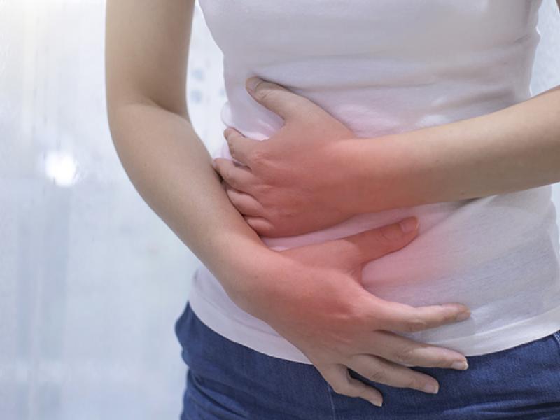 woman holding abdomen