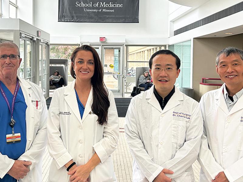 John Markley, Lindsey Saint, Dunpeng Cai and Shiyou Chen group photo