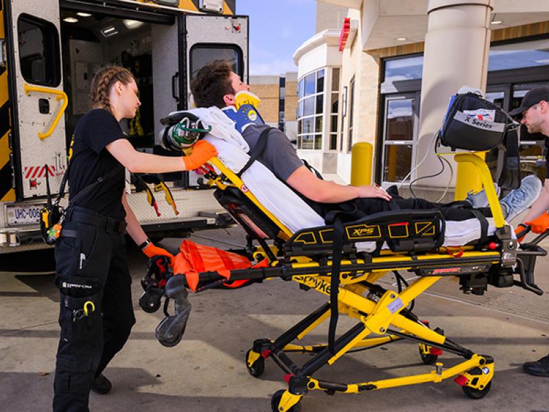 patient on gurney at an ambulance