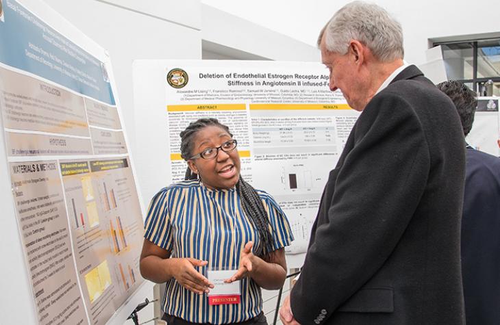 Photo of student and professor at Health Sciences Research Day.