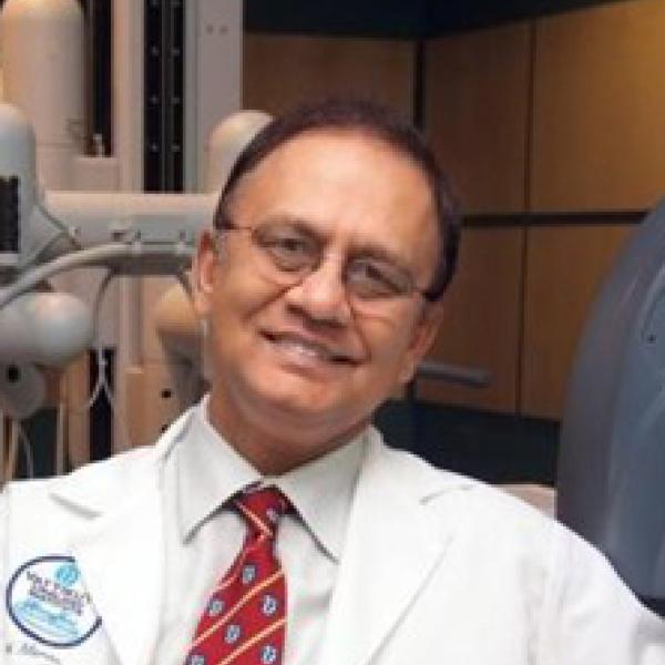 Dr. Mani Menon